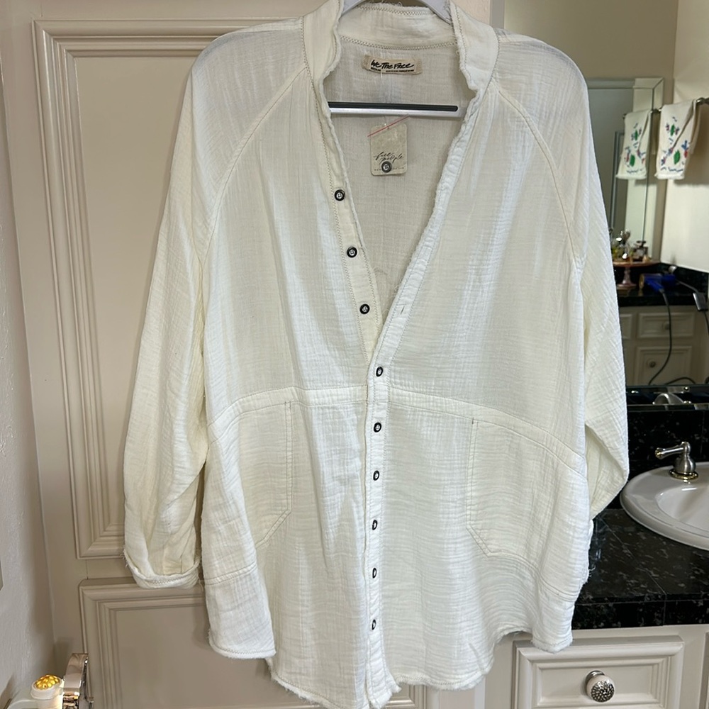 Free People white linen top. Runs large